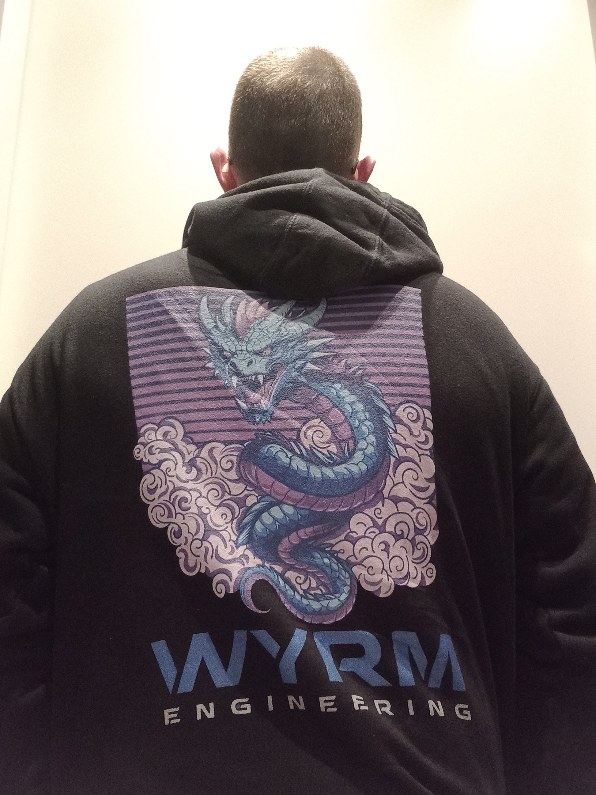 Black anime dragon hoodie with cosmic wyrm design